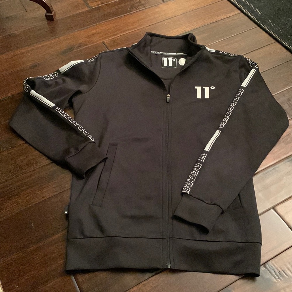 11 Degrees Black Zip front Jacket with sleeve stripe logo Size small-medium EUC